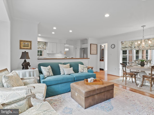 7287 Evans Mill Rd, Mclean, VA 22101 - living room with a chandelier, light wood-style flooring, crown molding, baseboards, and recessed lighting