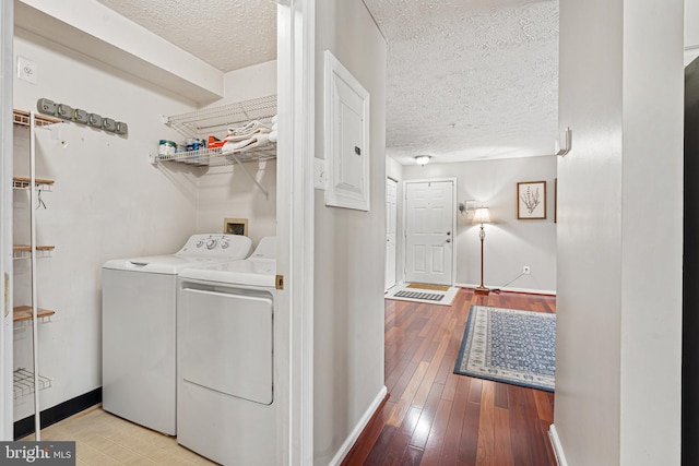 8357 Cypress Mill Rd Unit 8357, Nottingham, MD 21236 - laundry room with separate washer and dryer, a textured ceiling, baseboards, and wood-type flooring