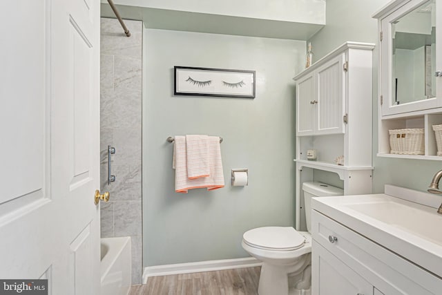 8357 Cypress Mill Rd Unit 8357, Nottingham, MD 21236 - bathroom with toilet, wood finished floors, baseboards, bathtub / shower combination, and vanity