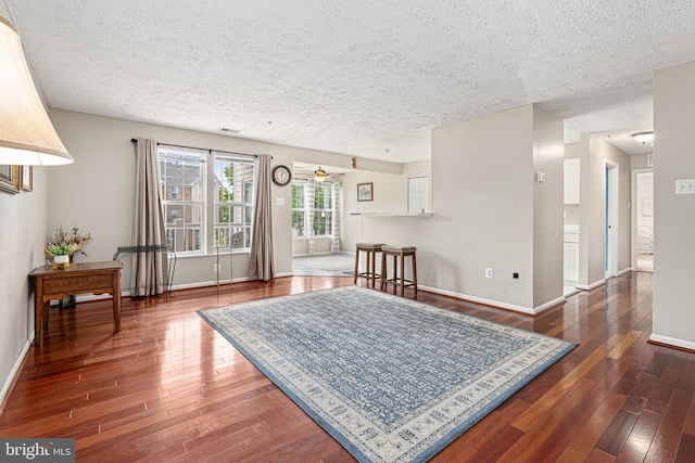 8357 Cypress Mill Rd Unit 8357, Nottingham, MD 21236 - living room with a textured ceiling, hardwood / wood-style flooring, baseboards, and ceiling fan