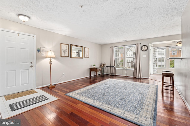 8357 Cypress Mill Rd Unit 8357, Nottingham, MD 21236 - foyer featuring a textured ceiling, hardwood / wood-style flooring, and baseboards
