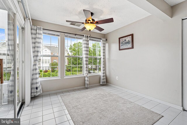 8357 Cypress Mill Rd Unit 8357, Nottingham, MD 21236 - empty room with ceiling fan, tile patterned flooring, a textured ceiling, and baseboards