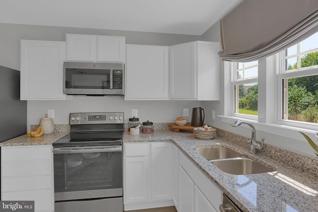 5385 Harrier Way, Waynesboro, PA 17268 - kitchen featuring stainless steel appliances, a sink, white cabinetry, and light stone countertops