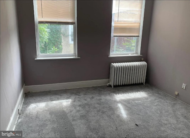 2236 Moore St, Philadelphia, PA 19145 - unfurnished room featuring radiator heating unit and carpet flooring