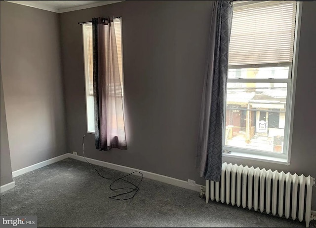 2236 Moore St, Philadelphia, PA 19145 - carpeted spare room featuring radiator, baseboards, and crown molding