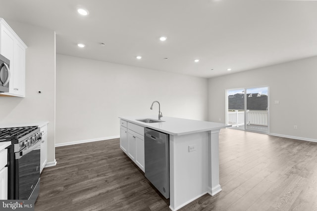 40 Marion Ave, Bordentown, NJ 08505 - kitchen featuring stainless steel appliances, a sink, dark wood finished floors, white cabinetry, and a center island with sink