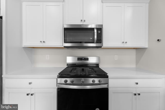 40 Marion Ave, Bordentown, NJ 08505 - kitchen with stainless steel appliances, light countertops, and white cabinetry