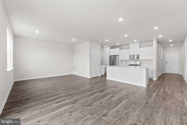 40 Marion Ave, Bordentown, NJ 08505 - unfurnished living room with a sink, wood finished floors, recessed lighting, and baseboards