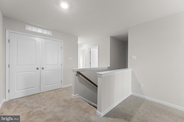 40 Marion Ave, Bordentown, NJ 08505 - hallway with an upstairs landing, carpet, and baseboards