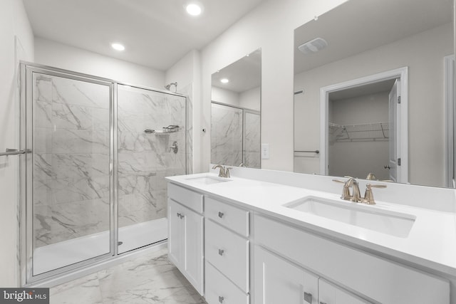 40 Marion Ave, Bordentown, NJ 08505 - full bath with marble look tiles, a marble finish shower, double vanity, recessed lighting, and a walk in closet