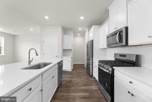 40 Marion Ave, Bordentown, NJ 08505 - kitchen featuring appliances with stainless steel finishes, a sink, recessed lighting, white cabinets, and dark wood-style floors