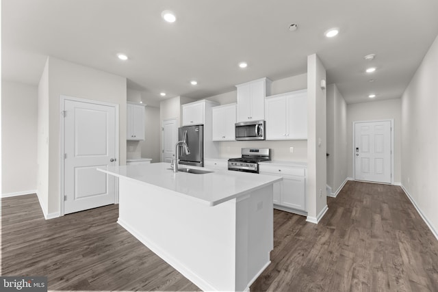40 Marion Ave, Bordentown, NJ 08505 - kitchen featuring stainless steel appliances, a sink, a center island with sink, dark wood-style floors, and white cabinetry