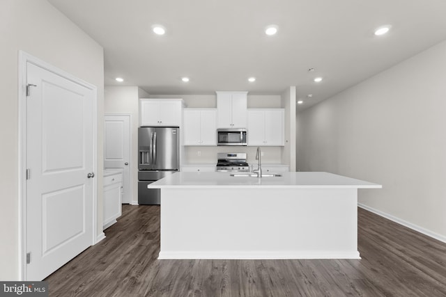 40 Marion Ave, Bordentown, NJ 08505 - kitchen featuring appliances with stainless steel finishes, an island with sink, a sink, white cabinetry, and dark wood-style floors