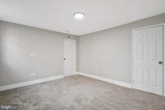 212 Oakwood St SE Unit B5, Washington, DC 20032 - spare room with carpet floors and baseboards