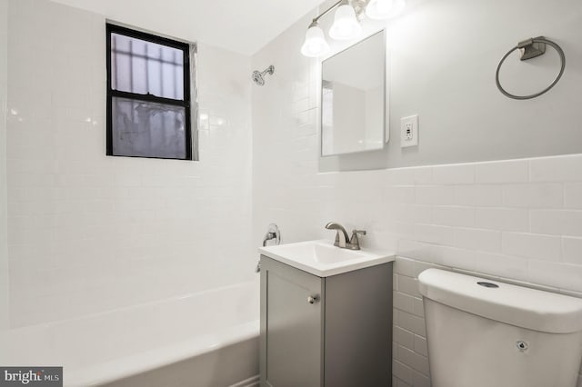 212 Oakwood St SE Unit B5, Washington, DC 20032 - bathroom with tile walls, toilet, shower / tub combination, and vanity