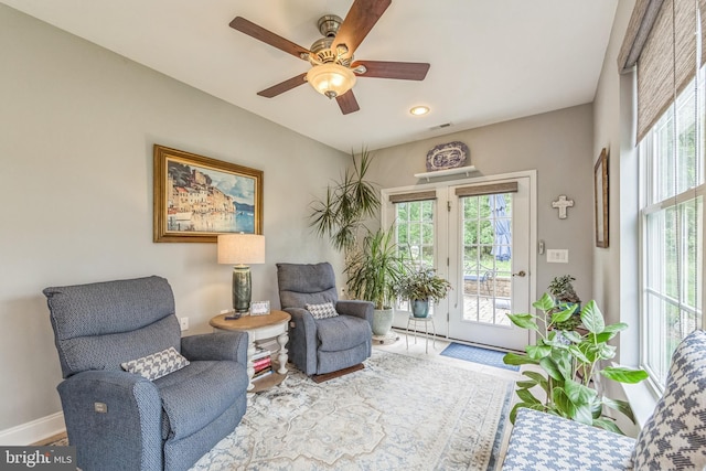 sitting room with baseboards, ceiling fan, and recessed lighting