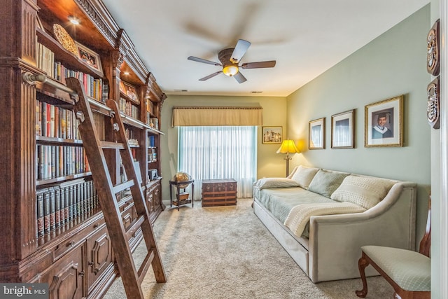 living room featuring carpet flooring and a ceiling fan