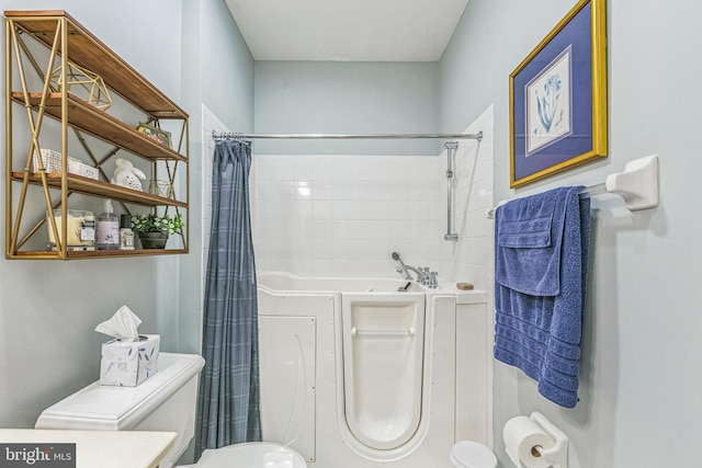 full bathroom featuring toilet and a shower with shower curtain