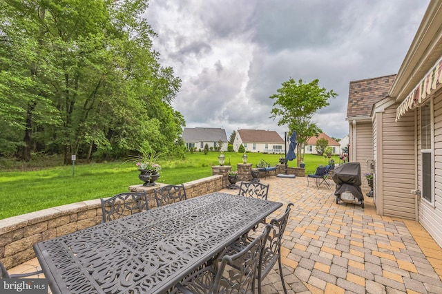 view of patio / terrace with outdoor dining area and a residential view