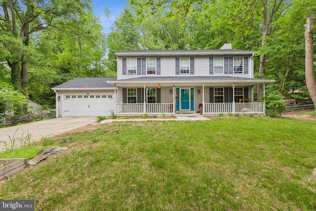11500 Acton Ln, Waldorf, MD 20601 - colonial house featuring covered porch, an attached garage, concrete driveway, a chimney, and a front yard