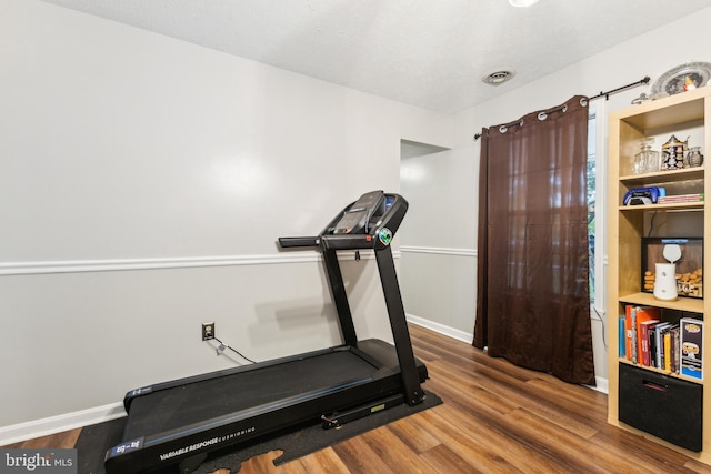 11500 Acton Ln, Waldorf, MD 20601 - exercise area featuring wood finished floors and baseboards