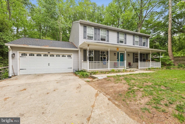 11500 Acton Ln, Waldorf, MD 20601 - colonial-style house with driveway, a porch, a garage, and view of wooded area