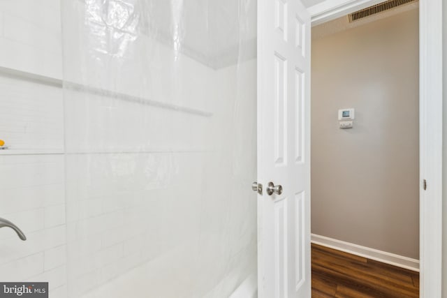 11500 Acton Ln, Waldorf, MD 20601 - bathroom featuring wood finished floors and tiled shower