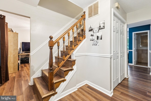 11500 Acton Ln, Waldorf, MD 20601 - stairs with wood finished floors and baseboards