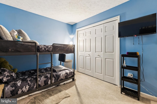 11500 Acton Ln, Waldorf, MD 20601 - carpeted bedroom featuring a closet and a textured ceiling