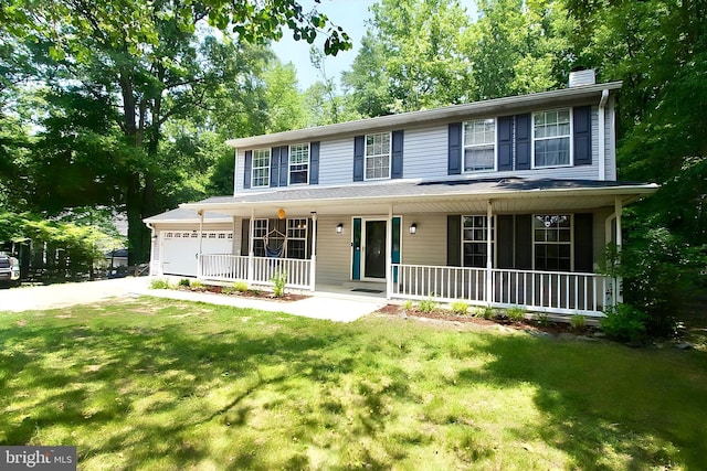 11500 Acton Ln, Waldorf, MD 20601 - colonial house featuring covered porch, a chimney, driveway, and a front lawn