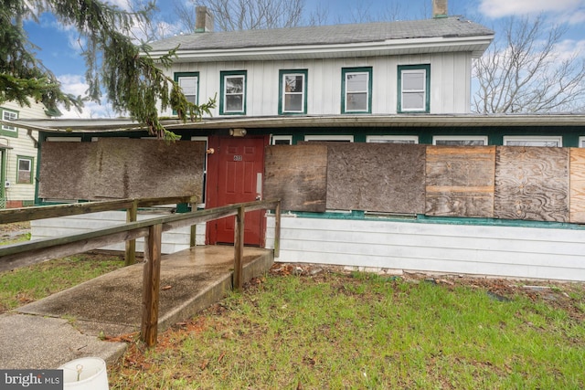611-615 S New York Rd, Absecon, NJ 08205 - view of front of house featuring a chimney, board and batten siding, and roof with shingles