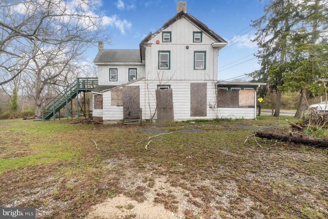 611-615 S New York Rd, Absecon, NJ 08205 - rear view of house featuring stairway, a chimney, and board and batten siding