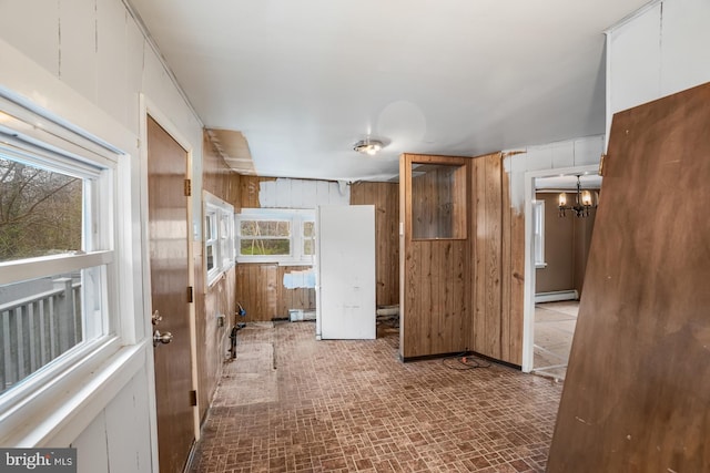 611-615 S New York Rd, Absecon, NJ 08205 - hall with a baseboard heating unit, wood walls, and a chandelier