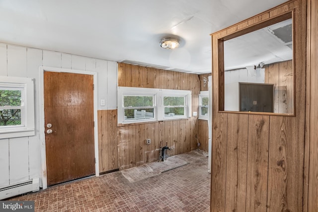 611-615 S New York Rd, Absecon, NJ 08205 - entrance foyer with plenty of natural light, wooden walls, baseboard heating, and brick patterned floors