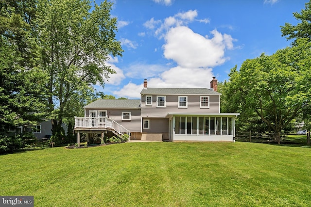 10 Hickory Dr, Doylestown, PA 18901 - rear view of house featuring a sunroom, a deck, a chimney, and stairs