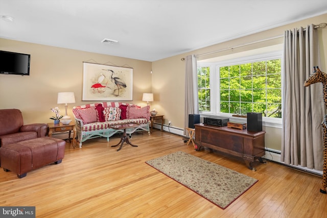 10 Hickory Dr, Doylestown, PA 18901 - living area featuring wood finished floors, a baseboard heating unit, and baseboard heating