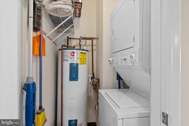 501 Michelle Ct Unit 25, Newark, DE 19711 - washroom featuring water heater and stacked washer / drying machine