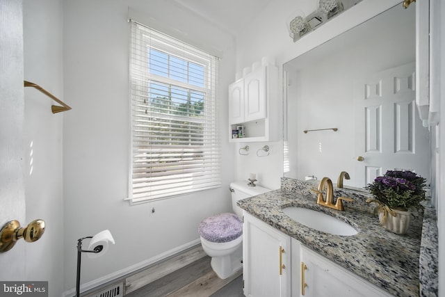 201 Anchor Cv, Stafford, VA 22554 - half bath featuring toilet, vanity, baseboards, and wood finished floors