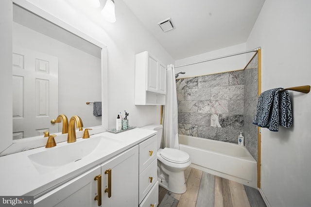 201 Anchor Cv, Stafford, VA 22554 - full bathroom featuring vanity, shower / bath combo with shower curtain, wood finished floors, and toilet