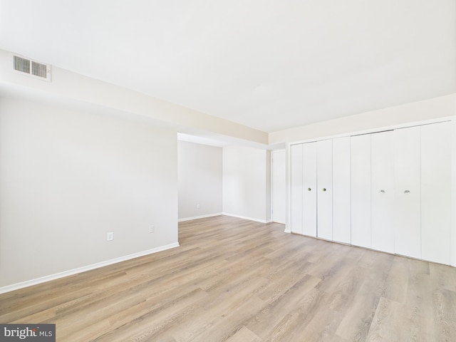 1643 Parkcrest Cir Unit 7C/101, Reston, VA 20190 - unfurnished bedroom featuring light wood-type flooring and a closet