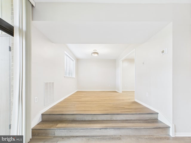 1643 Parkcrest Cir Unit 7C/101, Reston, VA 20190 - staircase featuring wood finished floors and baseboards