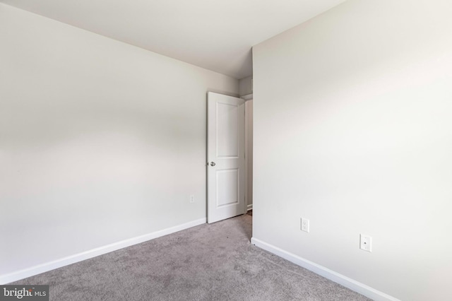 210 Slate Rd, Dover, DE 19904 - empty room featuring carpet and baseboards