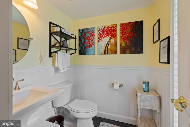 8 Pheasant Run Ct, Lutherville Timonium, MD 21093 - half bathroom featuring wainscoting, toilet, and a sink