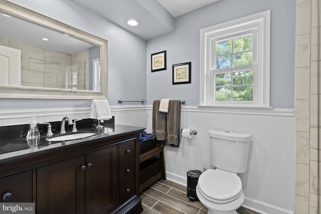 8 Pheasant Run Ct, Lutherville Timonium, MD 21093 - bathroom with wainscoting, toilet, vanity, wood finish floors, and a shower