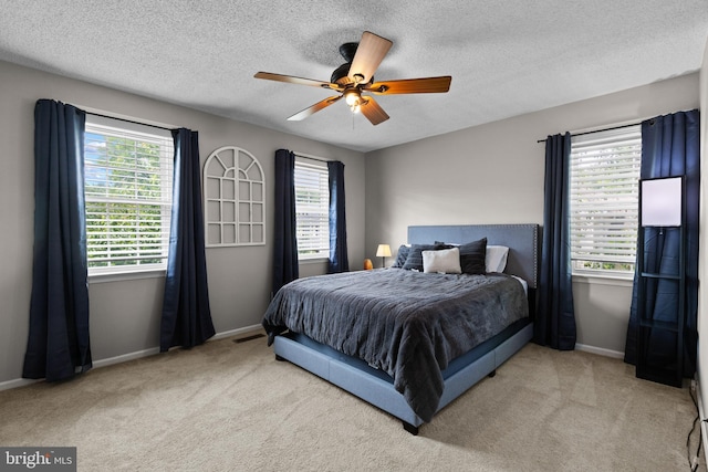 8 Pheasant Run Ct, Lutherville Timonium, MD 21093 - carpeted bedroom featuring a textured ceiling, baseboards, and ceiling fan
