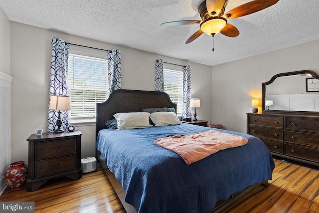 8 Pheasant Run Ct, Lutherville Timonium, MD 21093 - bedroom with wood finished floors, a textured ceiling, and a ceiling fan