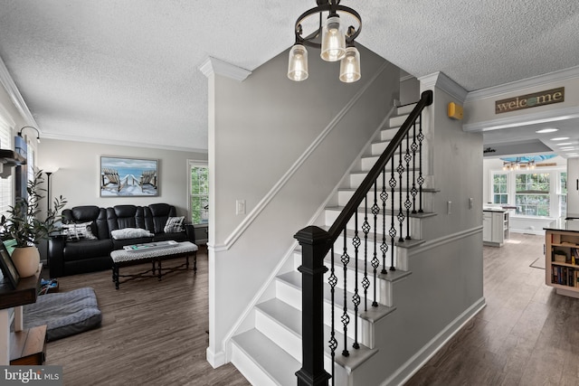 8 Pheasant Run Ct, Lutherville Timonium, MD 21093 - staircase with a textured ceiling, a chandelier, wood finished floors, ornamental molding, and baseboards