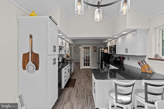 8 Pheasant Run Ct, Lutherville Timonium, MD 21093 - kitchen with white cabinets, dark wood finished floors, stainless steel appliances, lofted ceiling, and wooden ceiling