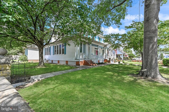 714 W St, Laurel, DE 19956 - view of front facade featuring a front yard