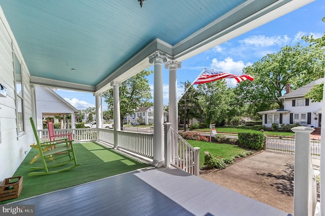 714 W St, Laurel, DE 19956 - porch with a residential view and a yard